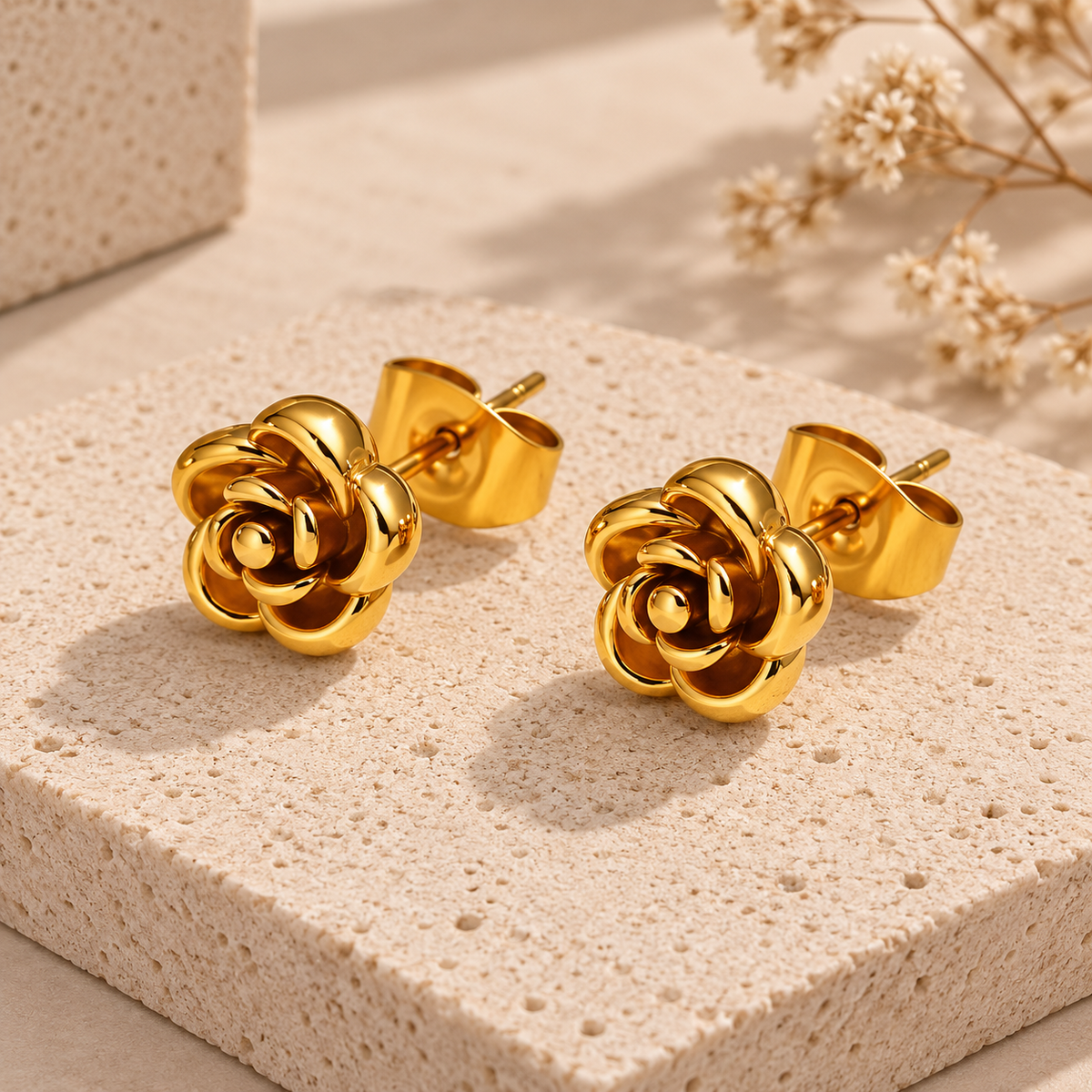 Pendientes Flor en acero dorado